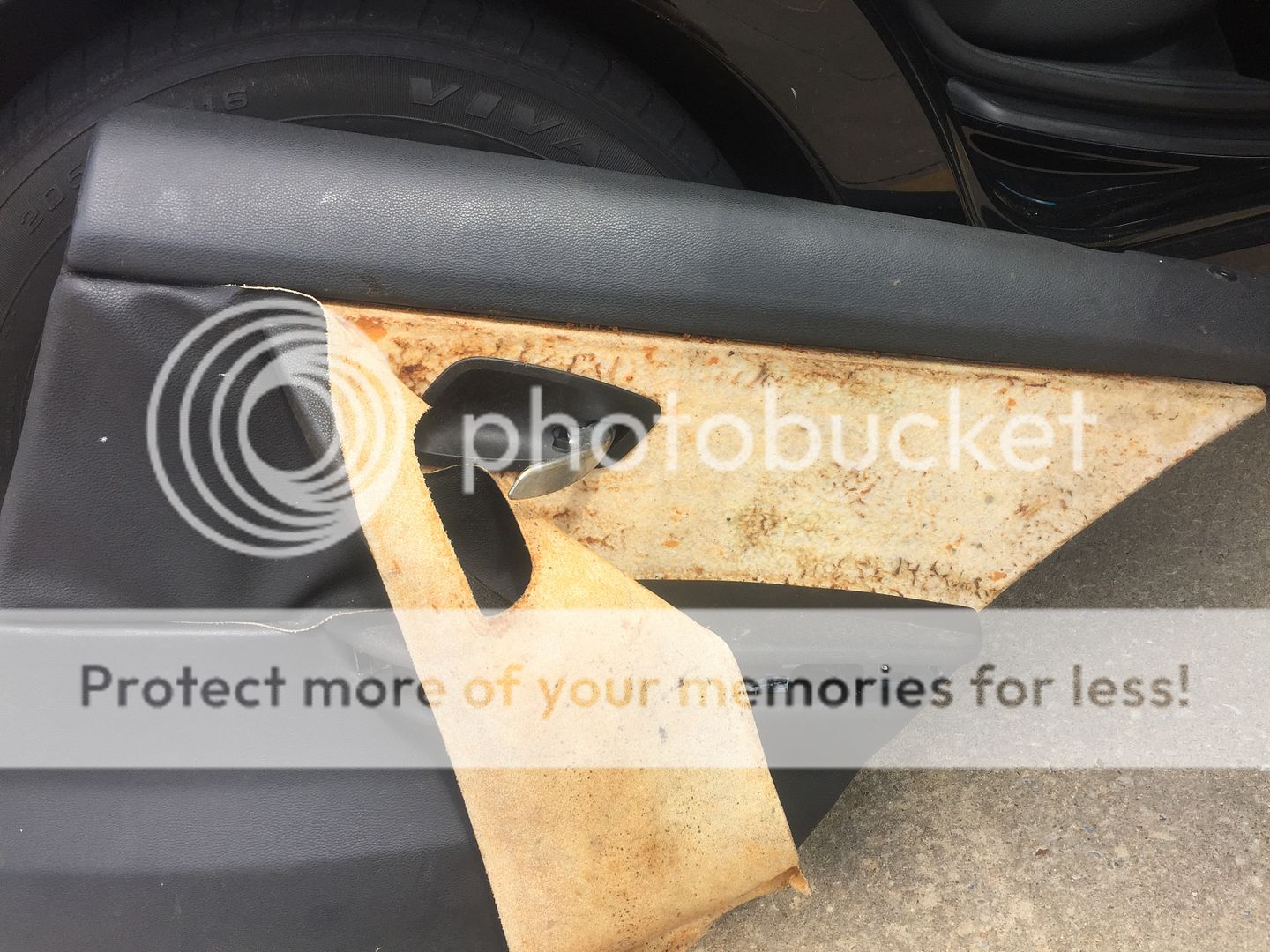 Peeling Door Panel Material. How do I fix it?